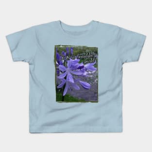 beautiful blue flower on the river Kids T-Shirt